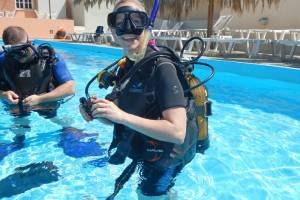A student practising scuba skills in the pool