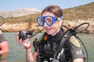 A first-time diver smiling